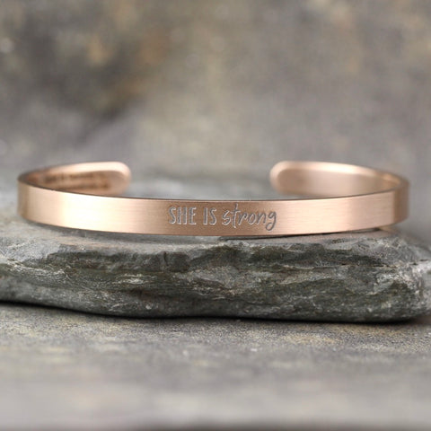 SHE IS STRONG inspirational message Cuff Bracelet - Stainless Steel in your choice of rose, yellow, steel or black - Engraved Bracelet